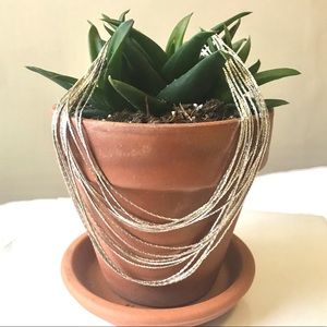 Whimsical silver-coloured necklace